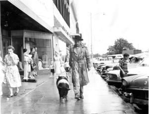 Porky on a leash with owner Justin Doak 1961